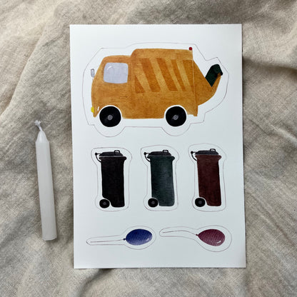 Müllauto-Caketopper als Dekoration auf einem Geburtstagskuchen für Kinder.